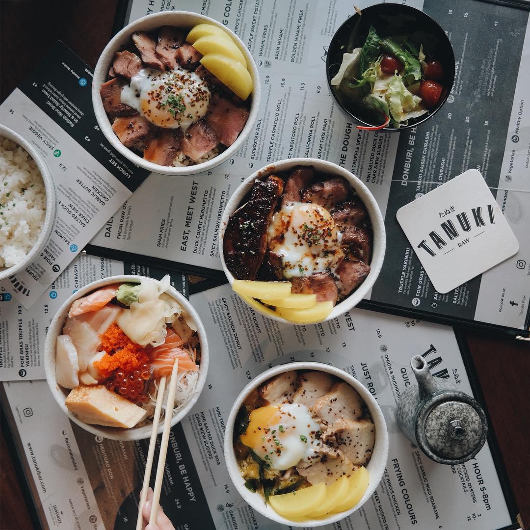 Tanuki Raw donburi bowls — multiple Japanese rice bowls with the Tanuki Raw menu