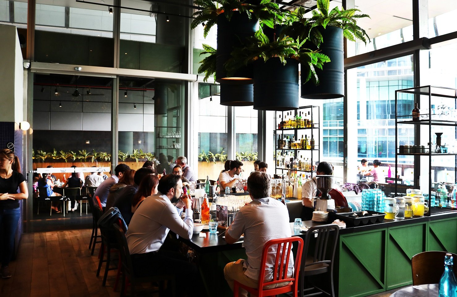 Tanuki Raw bar and dining room at Orchard Central Singapore — busy lunch and happy hour service